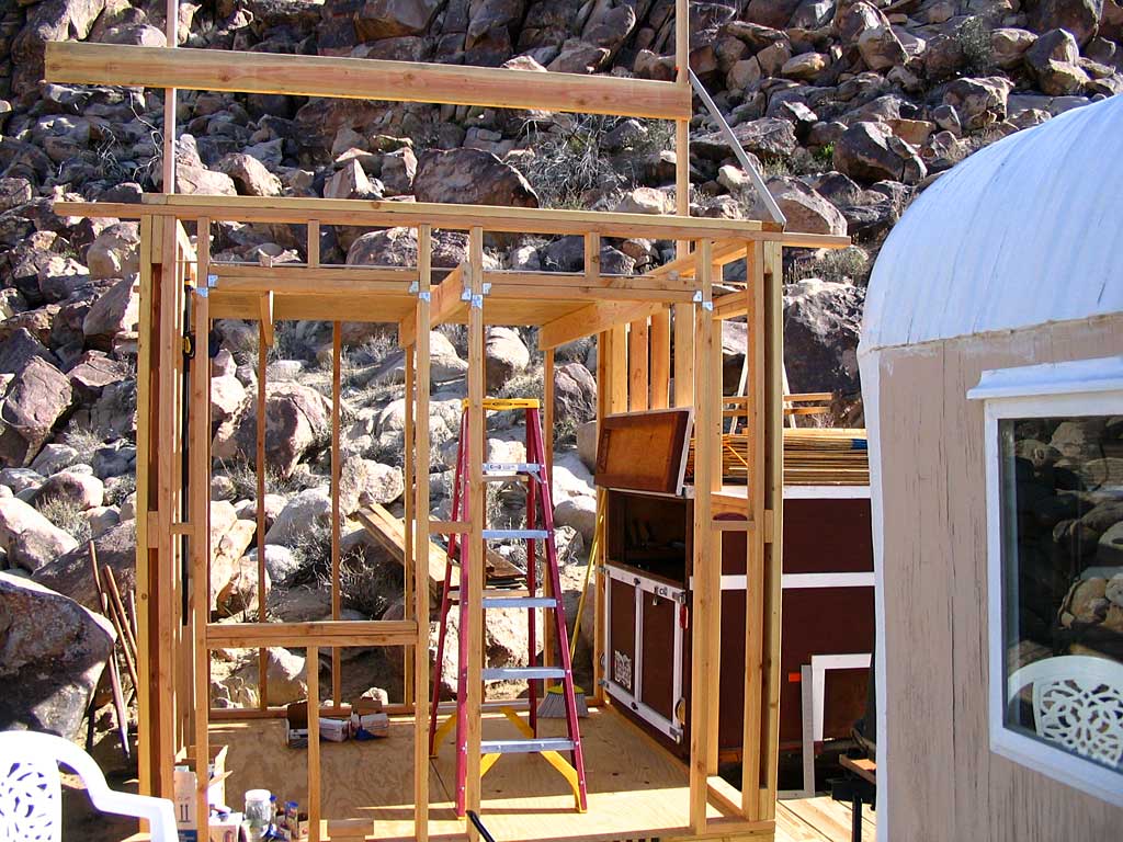 Ridge beam temporarily hung to get rafter lengths and angles