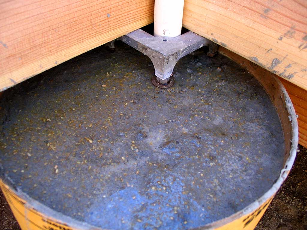 Shimming the concrete shrinkage gap with nuts