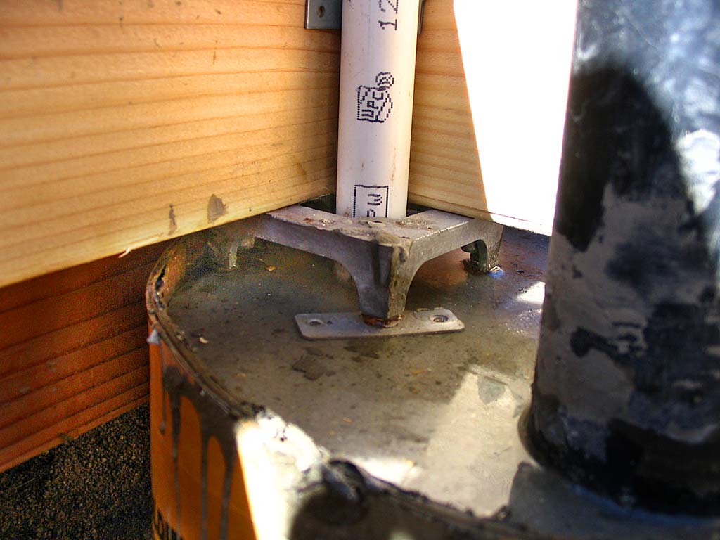 Shimming the concrete shrinkage gap with nuts