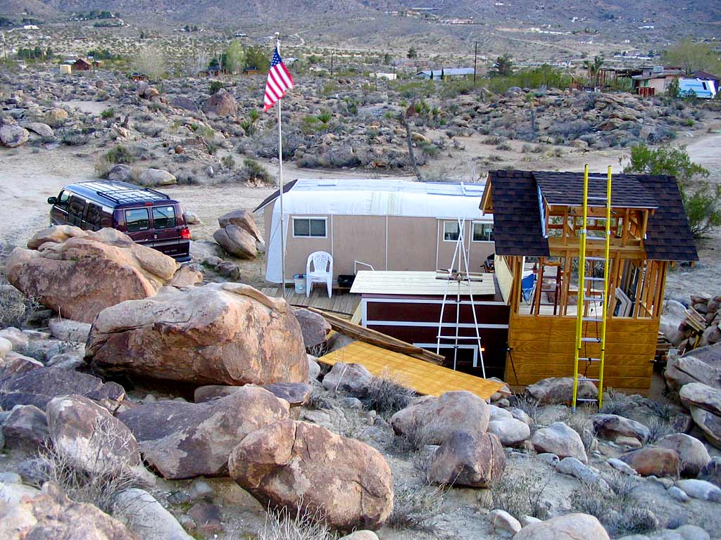 The first panel is clamped into place but not yet nailed