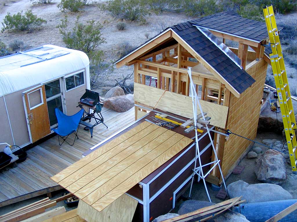 The second panel is clamped into place but not yet nailed