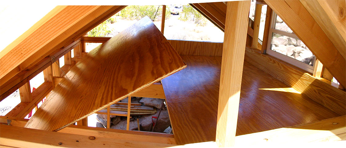 Second coat urethane on the dormer floor and one on the wall-to-be