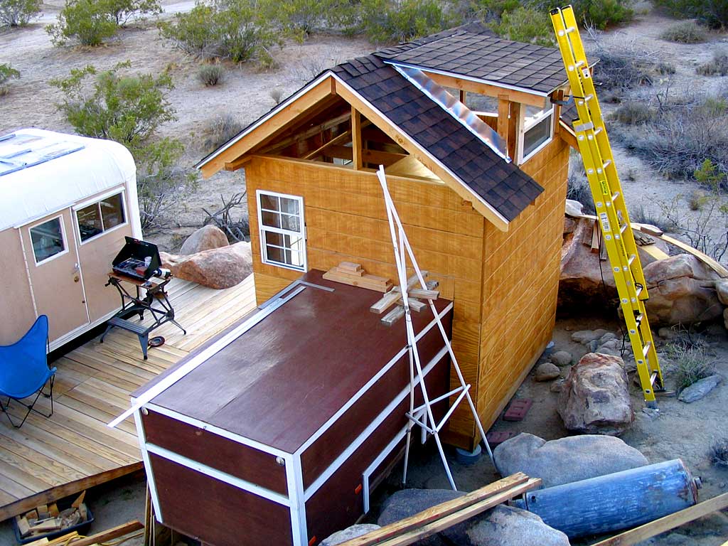 All four walls have been paneled with T1-11