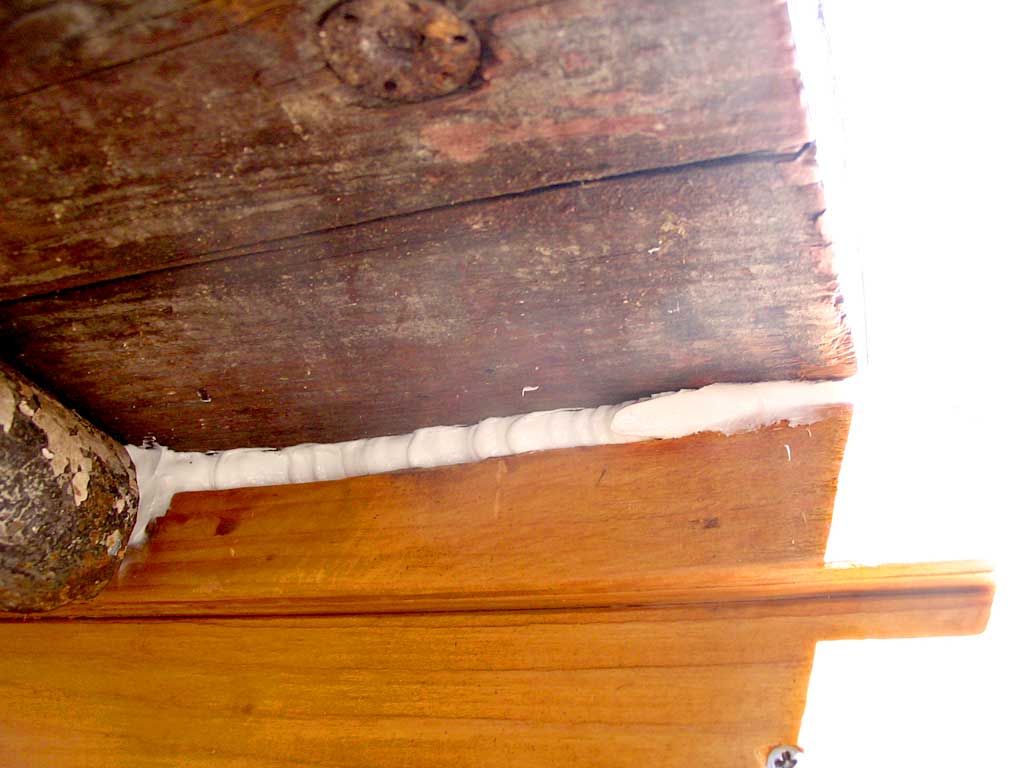 Caulking the right end of where the sill meets the trailer