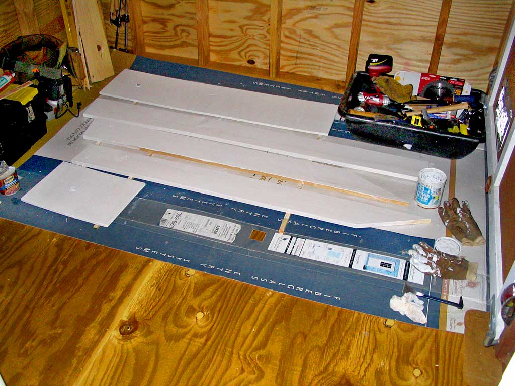 Priming the dormer's soffit and rake boards