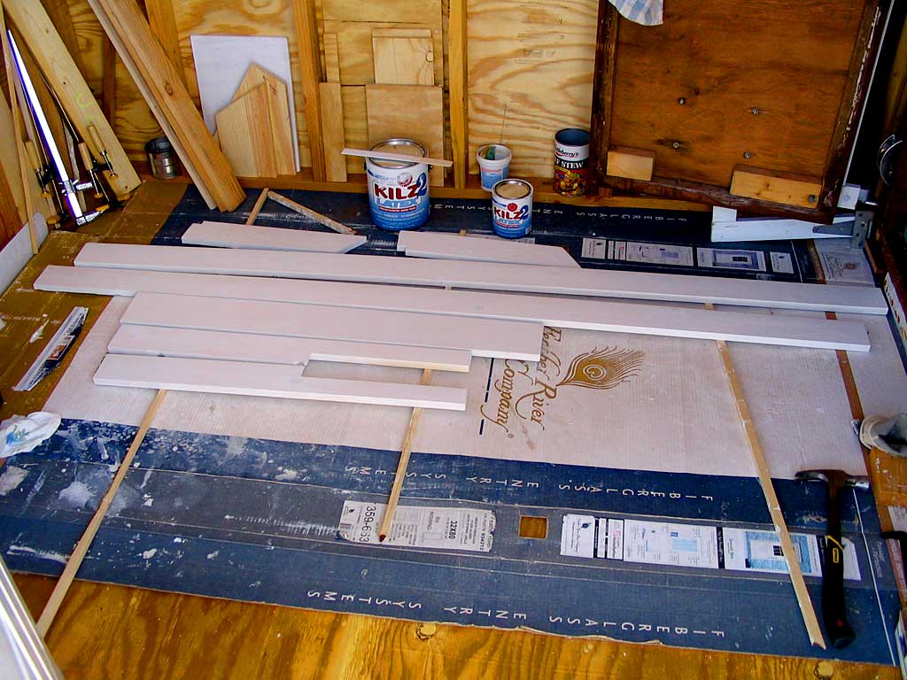 Priming the dormer corner trim and the northeast corner trim