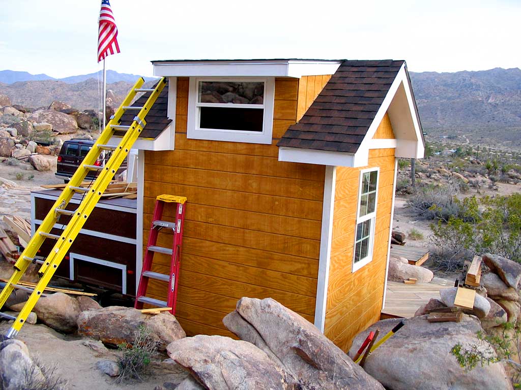 The southeast dormer corner trim and the northeast shed corner trim is in