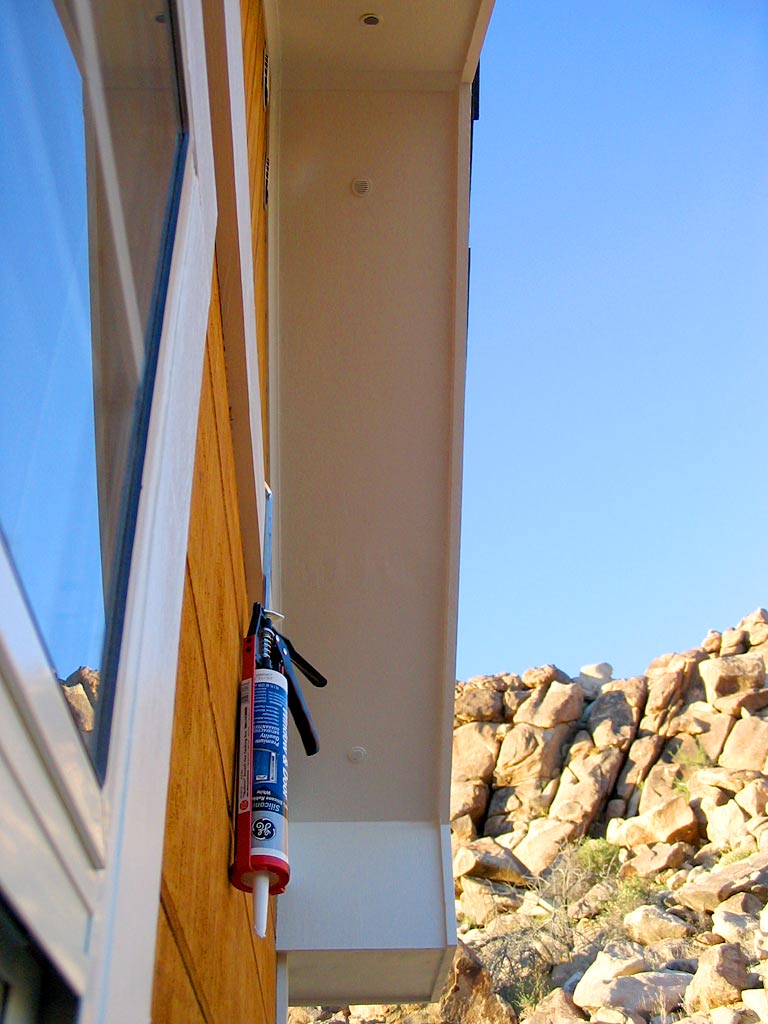 A gap between the south soffit and its rake has been caulked