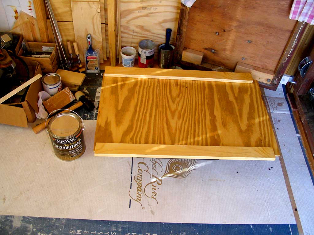 Adding door stops/handles to the dormer door and coating with polyurethane