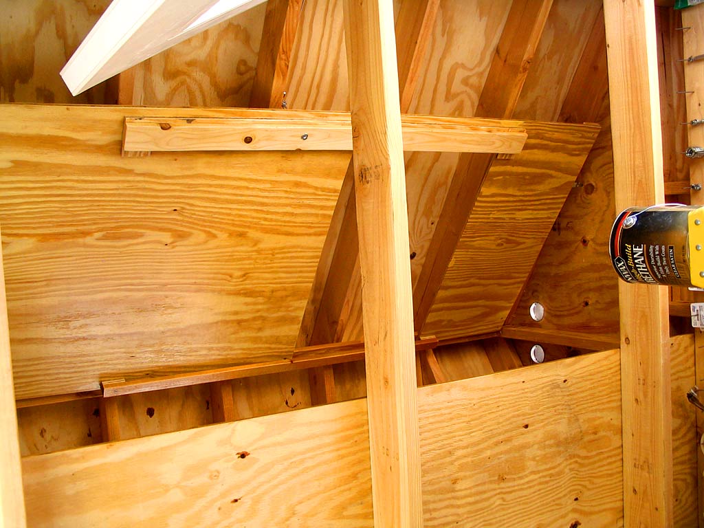 Applying urethane to the wall and tracks