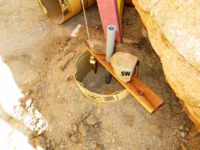 forming a post Hole for the southwest corner of the shed platform