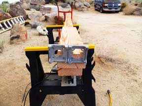 Attaching two aluminum footings to a post for the shed platform