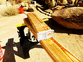 Attaching two aluminum footings to a post for the shed platform
