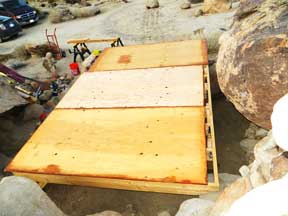 3/4 inch plywood Decking is being attached to The shed platform frame