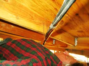 Taping Heat Tape Along A Pipe Under The Utility House