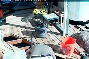 Vacuuming Loose Fire Hazard Brush Under Deck